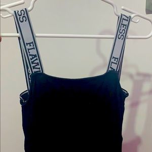 a small “flawless” strapped dress